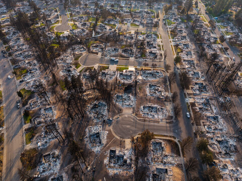 Aerial view of Spokane wildfire damage showing destroyed homes and charred trees in a residential neighborhood in Spokane, Washington, United States.