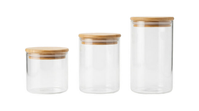 Three empty clear glass jars with wooden lids, ideal for kitchen storage of dry goods, spices, and pantry organization.