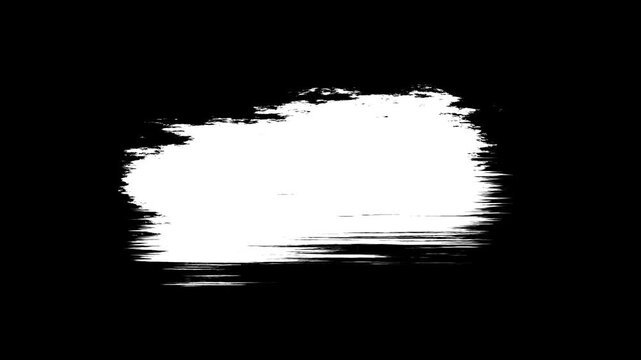 White paint spreads and dissolves on a black background