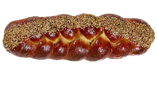 Golden brown challah bread with sesame seeds, isolated on transparent background