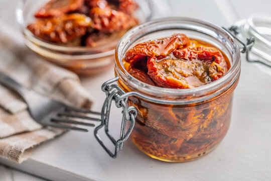 Sun-Dried Tomatoes in Glass Jar Preserved in Olive Oil for Gourmet Mediterranean Cooking
