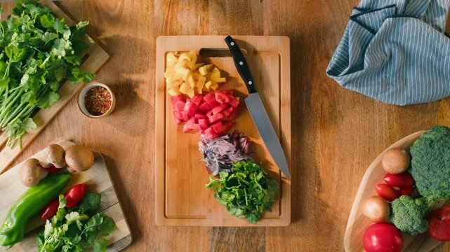 Salad mix, yellow sweet pepper, tomato, cilantro, parsley, Healthy food, Chef hands with knife for onion, cutting and preparation with cooking for dish. Restaurant stew. 