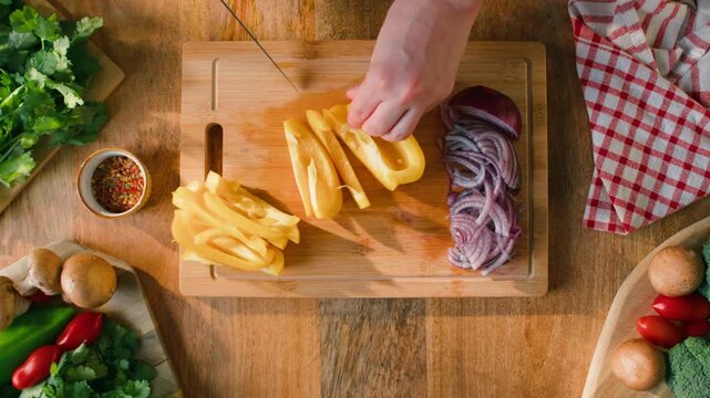 Man cut yellow sweet pepper, Healthy food, Chef hands with knife for onion, cutting and preparation with cooking for dish. Restaurant, culinary service and cook with skills for catering