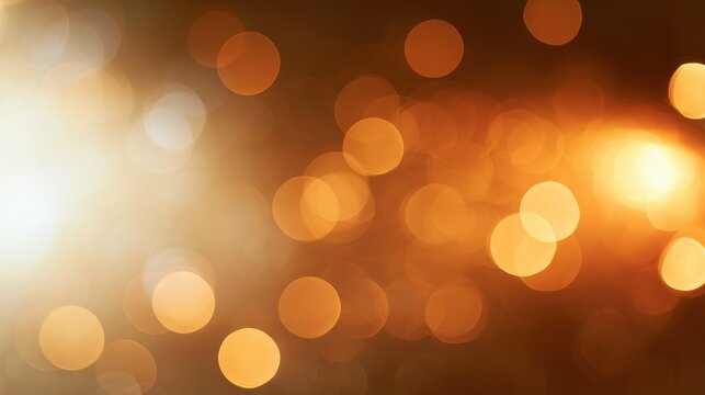 Warm amber bokeh background with soft yellow glow for design projects
