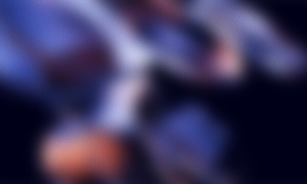 Abstract grainy gradient background with soft glowing light effects and dark blue tones