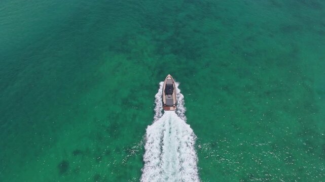 Vacation on summer. Yacht at sea. Motorboat yacht sailing at sea. Motorboat aerial top view. Luxury boat motor yacht at sea. Yachting boat tourism. Luxury lifestyle. Sea adventure