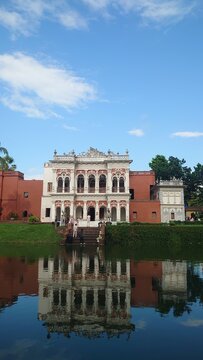 Historic White Bara Bari Rising Above Its Reflection on the Pond in Sonargaon, Bangladesh.
Historic White Heritage Building Reflected in the Calm Waters of Sonargaon, Bangladesh.