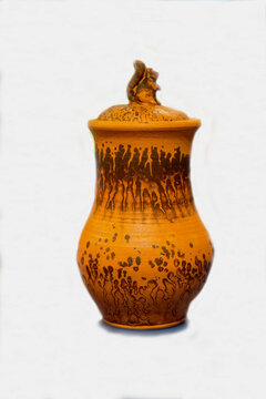 A pitcher made of Beloyevskaya clay isolated on a white background. The subjects are old technologies. World tourism.