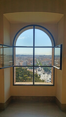 Fototapeta premium Scenic cityscape of rome through a window