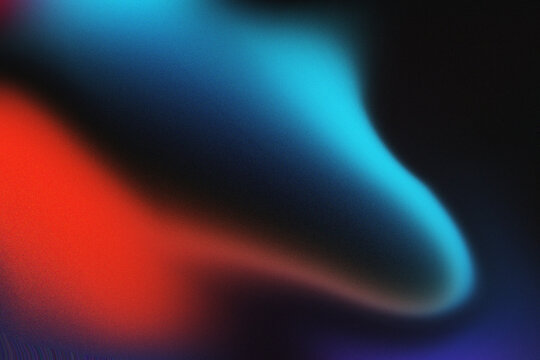 Abstract red and blue gradient background with soft light blur and grainy texture