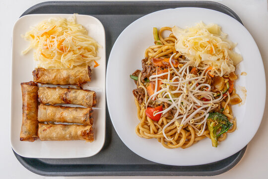 Fried Chinese spring roll on restaurant plate