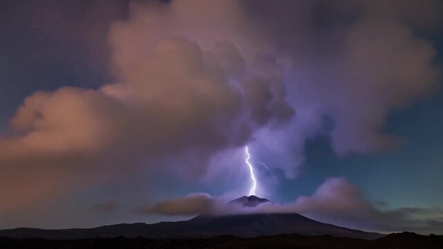 Dramatic Lightning Strike Illuminates Mountain Peak Under Stormy Night Sky