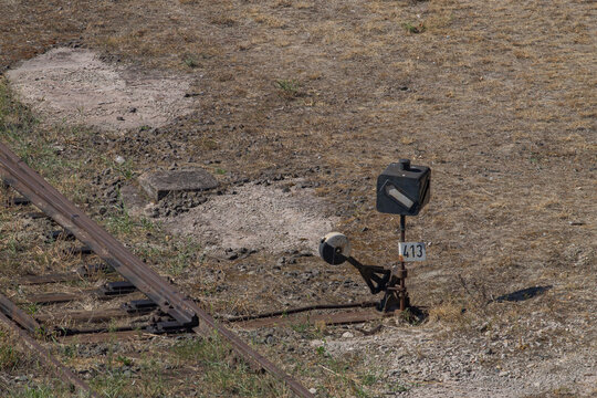 Old train mechanical track switch abandoned near the railroad