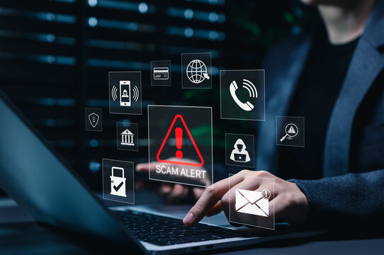 Scam alert warning. Cybersecurity concept. Woman using laptop and smartphone, warning sign for scams representing online threats, phishing, cybersecurity, Unknown person, suspicious scammer, fraud
