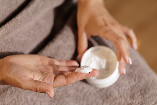 Woman Applying Moisturizing Hand Cream From Jar Close Up