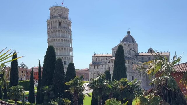Leaning Tower of Pisa and Cathedral Piazza dei Miracoli,  from the medieval city walls on a sunny day panoramic view.