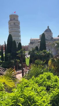 Leaning Tower of Pisa and Cathedral Piazza dei Miracoli,  from the medieval city walls on a sunny day panoramic view.