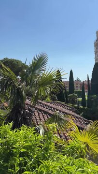 Leaning Tower of Pisa and Cathedral Piazza dei Miracoli,  from the medieval city walls on a sunny day panoramic view.