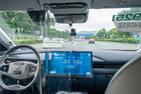 Shenzhen, China - May 20, 2026: Interior view of autonomous robotaxi driving on public urban road. Autonomous mobility, driverless transportation, artificial intelligence, future of urban transport.