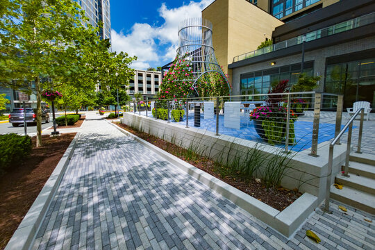 Flower covered metal tower anchors an outdoor dining area in Reston plaza.