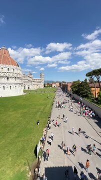 Leaning Tower of Pisa and Cathedral Piazza dei Miracoli,  from the medieval city walls on a sunny day panoramic high angle view.