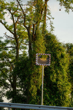 road mirror on a windy road with reflection