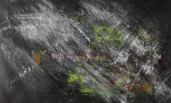 Paint stained and scratched black paper background, colorful scrabble, design element