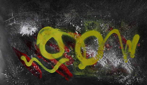 Paint stained and scratched black paper background, colorful scrabble, design element