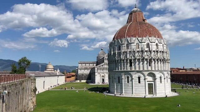 Piazza dei Miracoli in Pisa with the Baptistery of St. John, Cathedral and Leaning Tower under a blue sky, panoramic high angle view, Tuscany, Italy