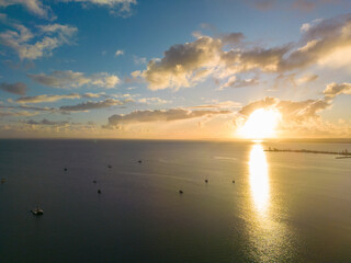 Fototapeta premium Golden sunrise over boats at Raby Bay, Queensland