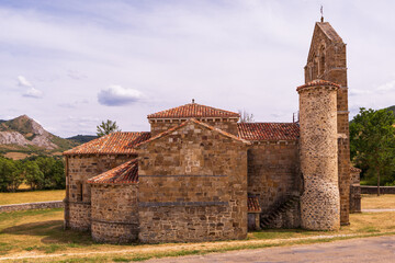 Fototapeta premium Romanesque collegiate church in north of Palencia, featuring Latin cross plan, single nave, and three semicircular apses