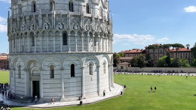 Piazza dei Miracoli in Pisa with the Baptistery of St. John, Cathedral and Leaning Tower under a blue sky, panoramic high angle view, Tuscany, Italy