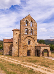 Fototapeta premium Romanesque collegiate church in north of Palencia, featuring Latin cross plan, single nave, and three semicircular apses