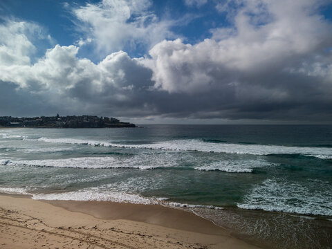 Bondi Beach, in Sydney with dramatic sky on a late winter sunny day.