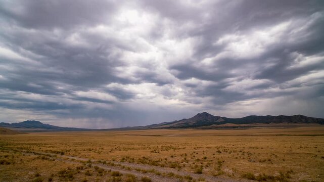 Timelapse looking through the dry Utah desert as wind blows dust across the landscape in Utah.