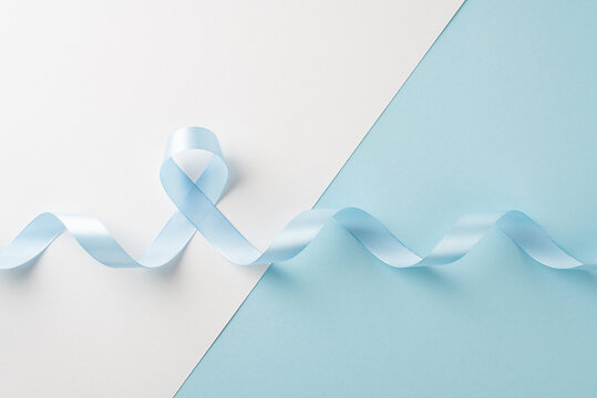 Blue ribbon on pastel background raising awareness for men's health during awareness month