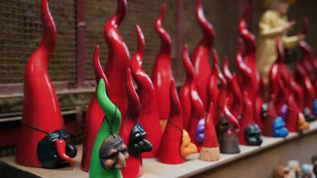 Red Horns against the evil eye and masks on a street in Naples superstition