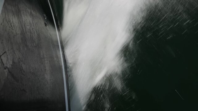 Waves and Wake Created by a Speedboat Moving Across the Sea