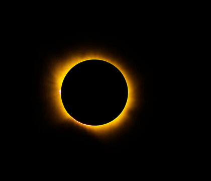 Solar eclipse glows against black sky
