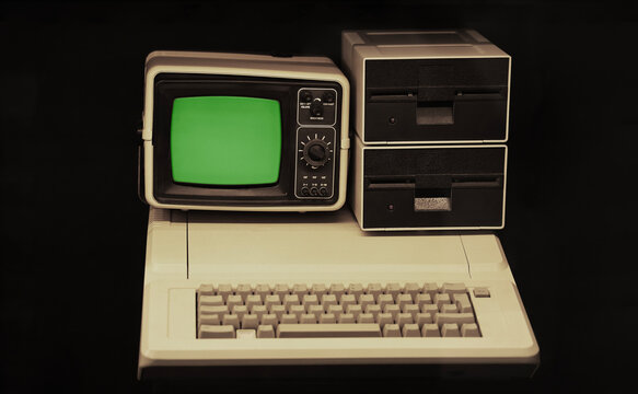Historical personal computer display monitor screen from year 1981 with two floppy drives, displayed on historical exhibition  chroma key Green screen monitor display