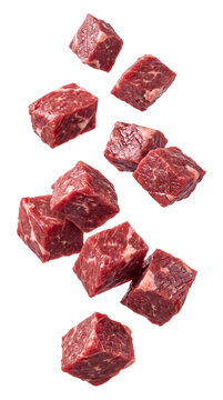 Falling raw beef cubes isolated on transparent background