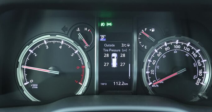 Car dashboard showing the outside temperature in winter
