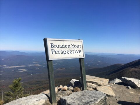 Broaden Your Perspective Sign Atop a Mountain Summit