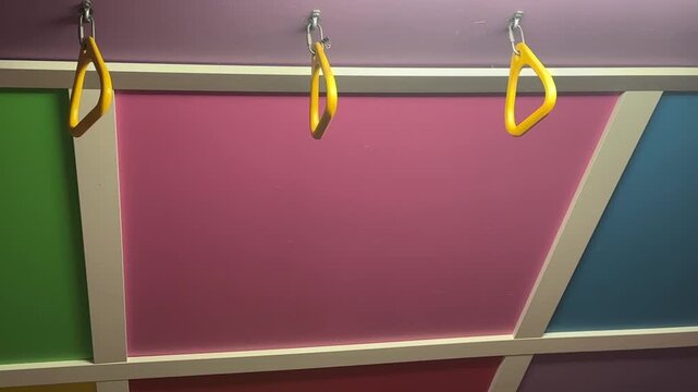 Indoor Monkey Bars in a Child&rsquo;s Playroom With plastic Climbing Equipment, Soft Flooring and Bright Home Recreation Space