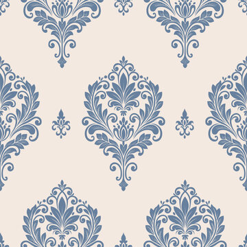 Elegant blue floral damask pattern on a soft beige background, featuring ornamental leaves, scrolling motifs, and classic vintage elegance for wallpaper and textile design.