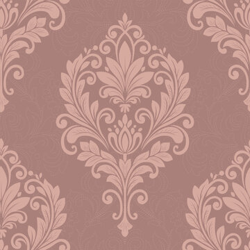 Elegant vintage damask pattern with ornate floral scrolls and botanical motifs in a soft dusty rose and blush palette, creating a luxurious seamless wallpaper background.