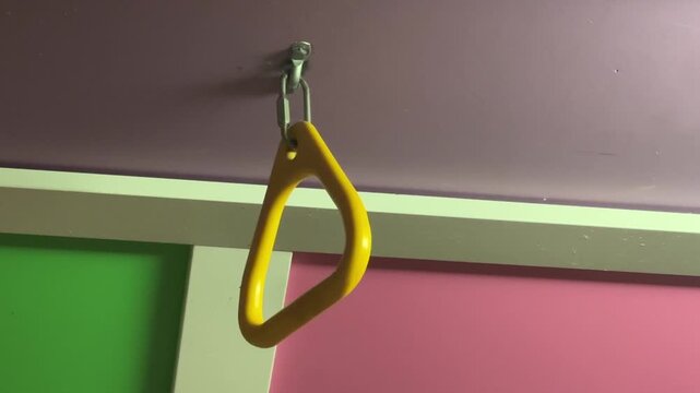 Monkey Bars Inside a Child&rsquo;s Playroom With Indoor Play Equipment, Climbing Structure and Colorful Childhood Recreation Space