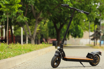 Electric scooter for urban mobility and sustainable transportation, modern e-scooter parked on a...