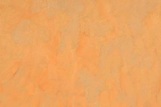 orange watercolor background painted on paper texture