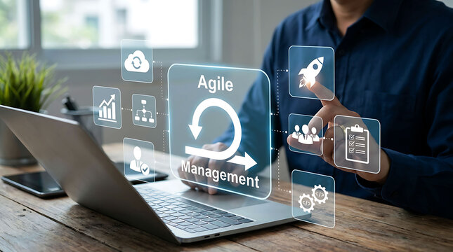 Businessman working on laptop with agile management methodology screen icons